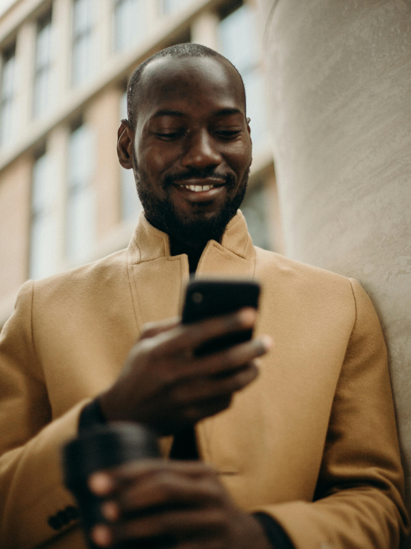 Man on phone texting.