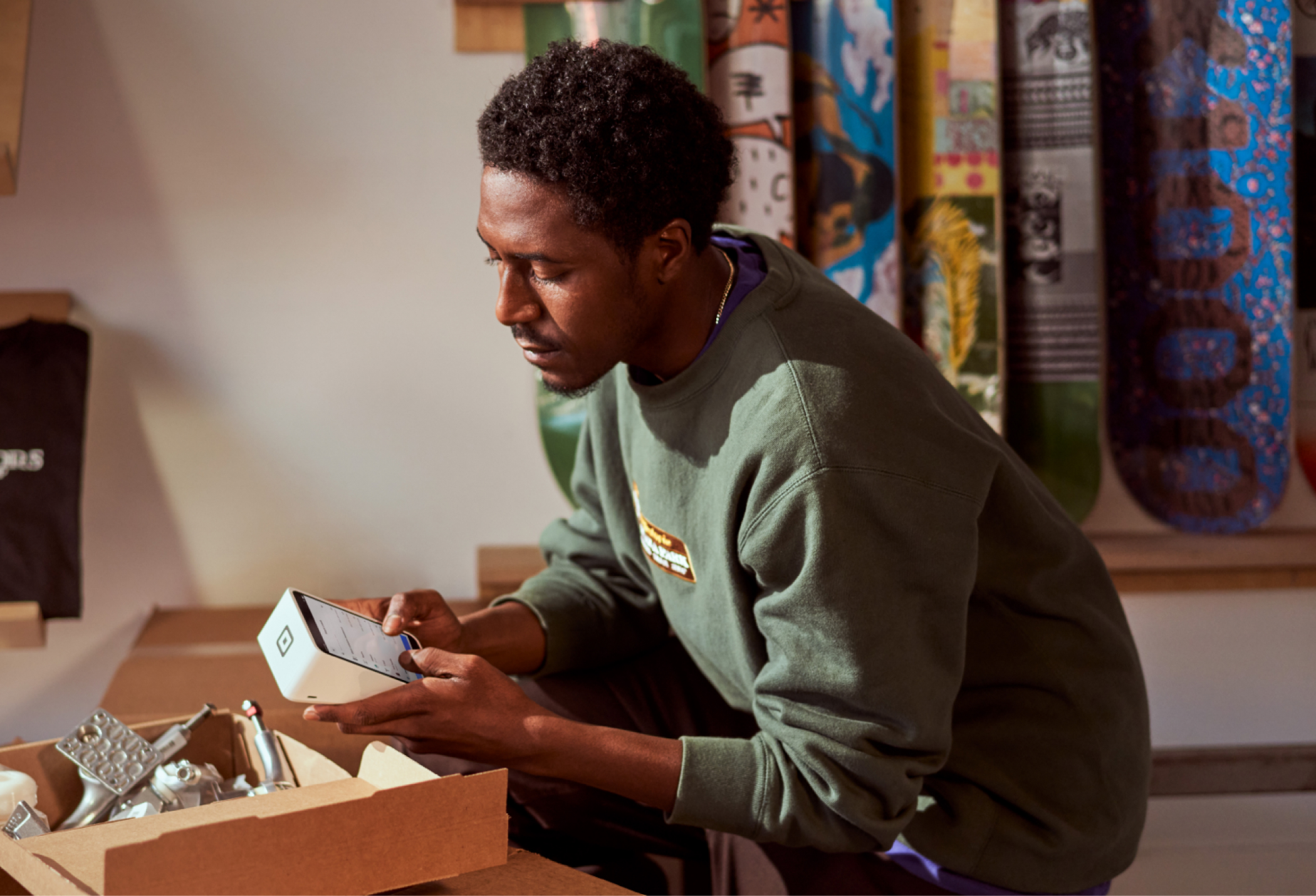 Customer placing order on mobile app at table.